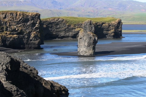 Rock Pillar At The Beach Of Dyrholaey